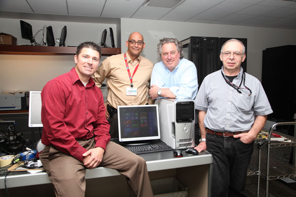 From left, GMHC tech staff Jon Russo, Pedro Gonzalez, Dave Tainer and Michael Shnitser.  Photo by Adam Fredericks