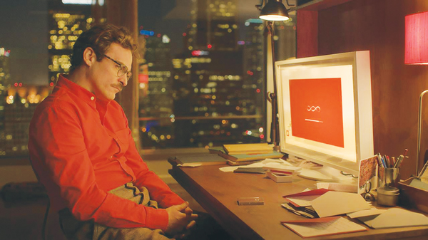 Joaquin Phoenix stars in “Her,” a love story about a man and his computer.  WARNER BROS. PICTURES