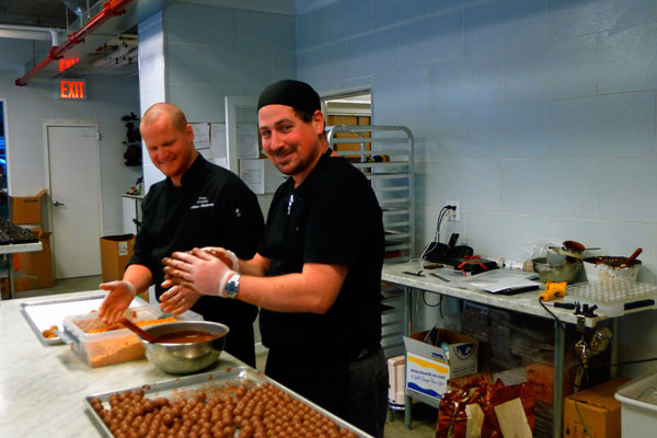 Hakan Martensson, left, and Joav Hak, from Israel, rolling truffles by hand at Fika in Tribeca.    Photo by Heather Dubin