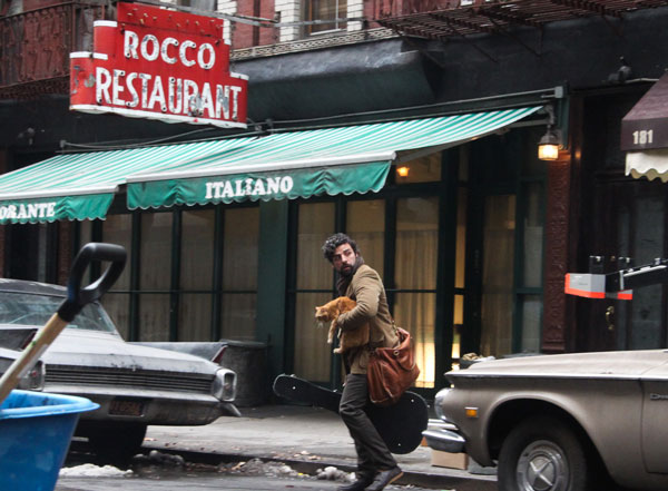 In March 2012, the Coen brothers shot exterior scenes in the Village for “Inside Llewyn Davis,” their film about the ’60s folk scene. In this scene, Oscar Isaac, who plays the lead, is moving into an apartment on Thompson St.  Photo by  Tequila Minsky