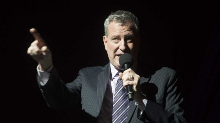 Mayor-elect Bill de Blasio reflects about the life of Nelson Mandela as he addresses the congregation at the Christian Cultural Center in Brooklyn. (Dec. 8, 2013)