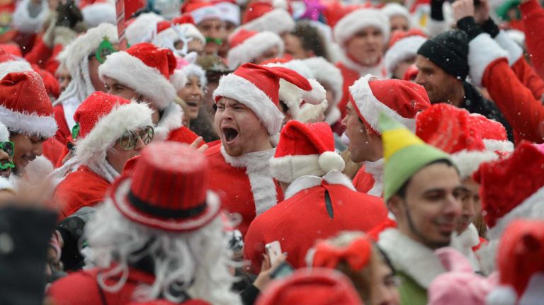 Santa Con organizers aim to hit streets Saturday with less rowdy crowd 2 New Yorkers gather in Tompkins Square Park for the annual SantaCon bar crawl in New York City. (Dec. 14, 2013)