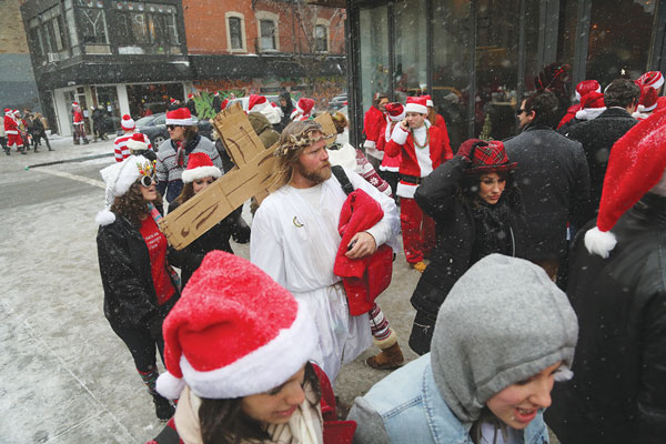 SantaCon ‘zones in’ on L.E.S. and E.V. again this year 3 Heaven forgive them.... A scene from Santacon two years ago on Second Ave. in the East Village. File photo by Jefferson Siegel
