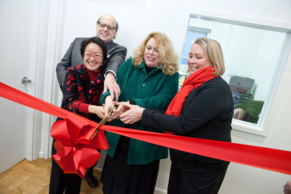 At the ribbon-cutting for Visiting Neighbors’ new offices in Washington Square Village, from left: Councilmember Margaret Chin; David Gruber, Community Board 2 chairperson; Cynthia Maurer, Visiting Neighbors executive director; and Alicia Hurley, of N.Y.U.  ©NYU Photo Bureau: Asselin