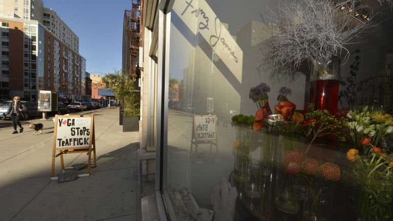 This is a view from the vibrant business district along Frederick Douglass Boulevard at West 114th Street in South Harlem.