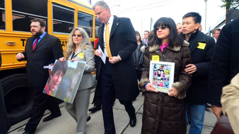 New York City Mayor Bill de Blasio is joined by families of traffic fatality victims before announcing a new plan on Jan. 15, 2014 to reduce the number of fatal traffic accidents.