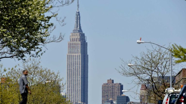 A view of the Empire State Building from Queens Boulevard.