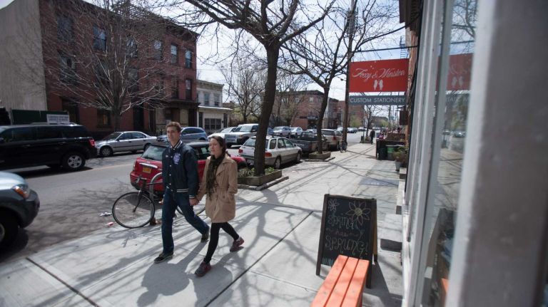 People walk down Van Brunt Street in Red Hook. (Apr. 20, 2013)