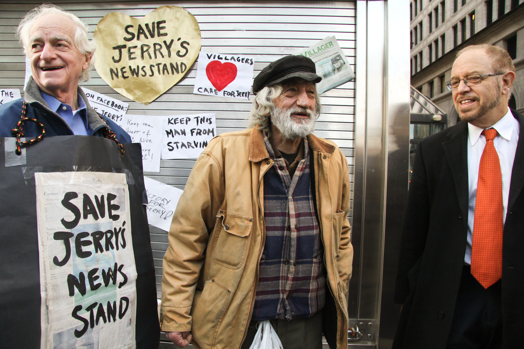 From left, Marty Tessler, a former Community Board 2 member who championed Jerry Delakas's cause; Delakas; and his attorney, Arthur Schwartz, who negotiated the settlement allowing him to regain the newsstand.