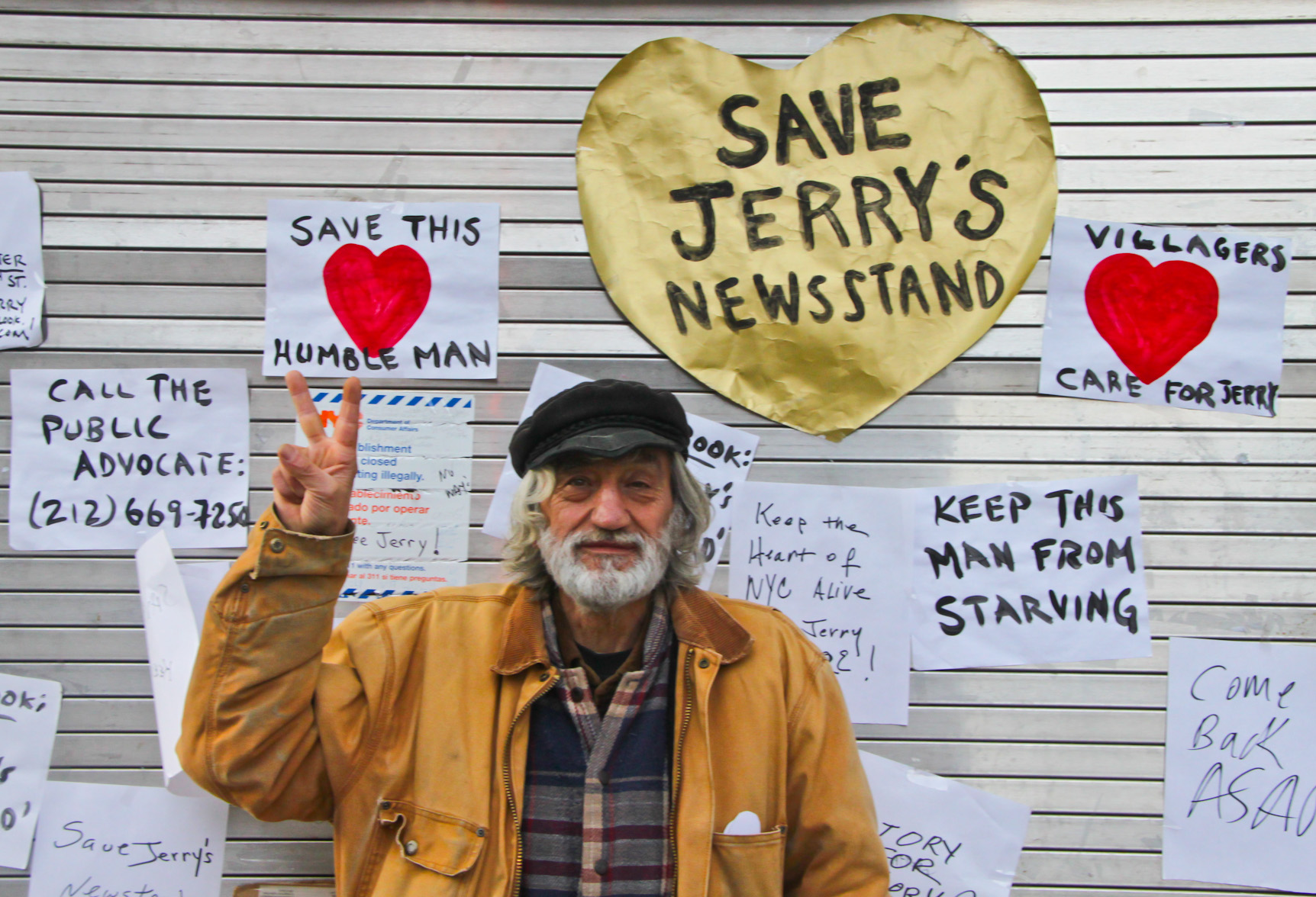 Victory! Jerry Delakas at his Astor Place newsstand at Monday's press conference announcing the news that he reached an agreement with the city allowing him to reopen the stand. Photo by Tequila MInsky