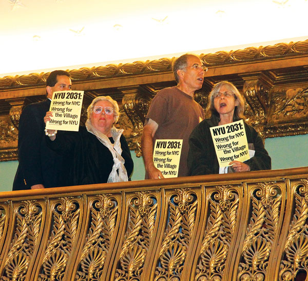 Last July, before the City Council voted nearly unanimously to approve the N.Y.U. 2031 plan, Council Speaker Christine Quinn cleared the Council Chamber’s balcony of protesters, who had started hooting and hissing. Above from left, Ruth Rennert, a Washington Square Village resident, and Paul and Marianne Edwards, 88 Bleecker St. residents, shouted their displeasure over the Council’s anticipated vote as they were ejected from the Council Chambers.  File photo by Tequila Minsky