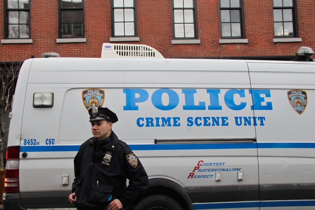 Police outside 35 Bethune St. after actor Philip Seymour Hoffman was found dead in his apartment on Sunday.  Photo by Tequila Minsky