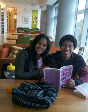 Claryssa Santana and Julio Pena, 16-year-olds from the South Bronx, reading a poetry book together at Poets House.   Photo by Lee Briccetti