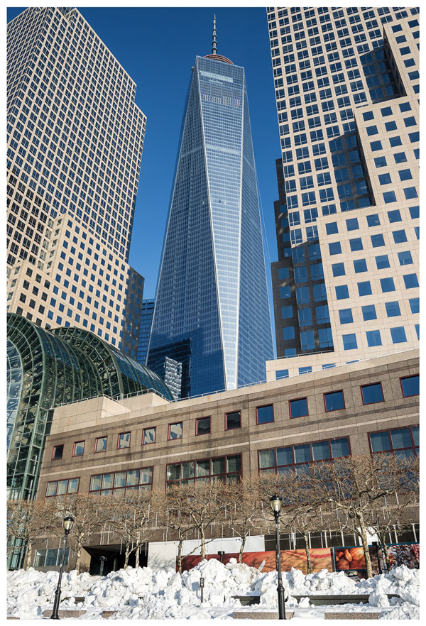 Downtown Express photo by Scot Surbeck | Inset photo by Josh Rogers   One World Trade Center, a.k.a.  the Freedom Tower, as seen earlier this month from Battery Park City. Later this year, the first companies will begin moving into the 1,776-foot building. It is being built by the Port Authority and the Durst Organization.  Insert: Platform A, the first platform of the new W.T.C. Transportation Hub, opened to PATH commuters Tuesday. “The design, the architecture, truly makes a statement and that statement is ‘we’re back and we’re better than ever,’” Steve Plate,  who oversees W.T.C. construction for the Port, said at the platform opening. The new design by Santiago Calatrava also gives the public its first view of the W.T.C. slurry wall since the site has been rebuilt to street level. The wall, which helps protect the site from flooding and survived 9/11, took on symbolic meaning for many after the attack.   