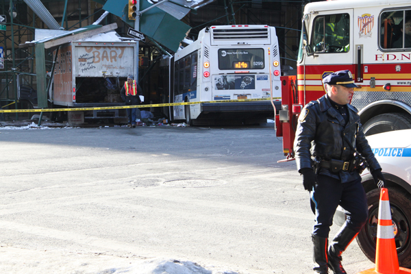 A stolen truck and cross-town bus collided and both smashed into the southeast corner of 14th St. and Seventh Ave. Wednesday morning.  Photo by Tequila Minsky