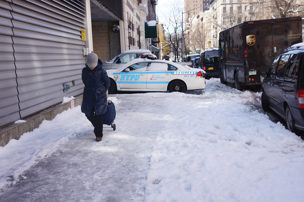 Pedestrians had to navigate this iced-over sidewalk outside the NYCHA police station’s parking garage on E. Ninth St. and Avenue C.