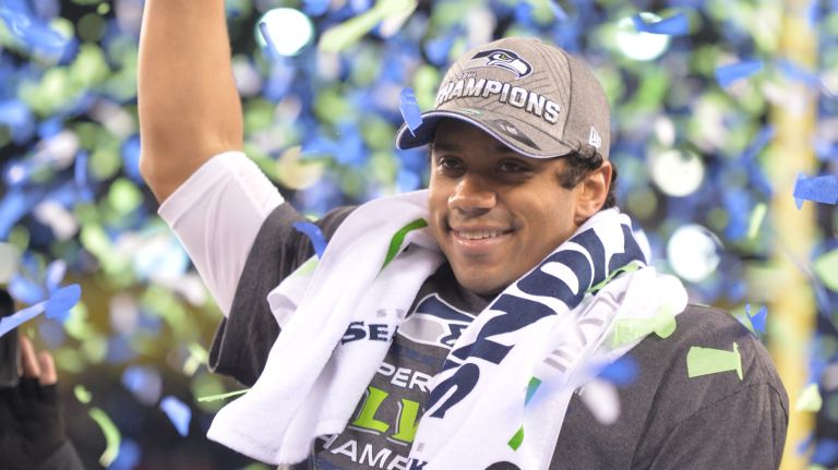 Seahawks trounce Broncos to win Super Bowl XLVIII 2 Seattle Seahawks quarterback Russell Wilson celebrates his Super Bowl victory at MetLife Stadium on February 2, 2014.