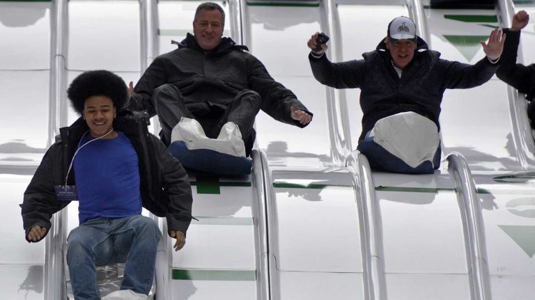 New York Mayor Bill de Blasio is seen with his son Dante and others on the Super Bowl Toboggan Run on Saturday, Feb. 1, 2014.