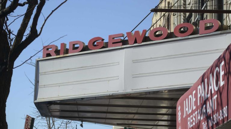 A sign at a old movie theatre on Myrtle Avenue in Ridgewood.