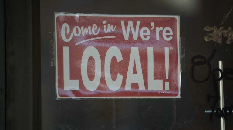 A sign on the door of Norma's on Catalpa Avenue. 