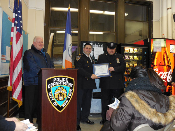 Cop of the Month 1 Photo by Scott Stiffler Left to Right: Community Council President Larry O'Neill and Captain David Miller (10th Precinct Commander) honor Officer Eric Rivera for his exemplary Christmas Eve actions.