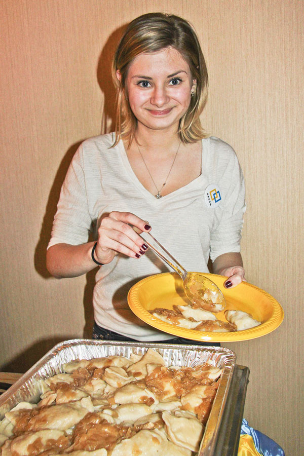 A woman served potato pierogis at the fundraiser.