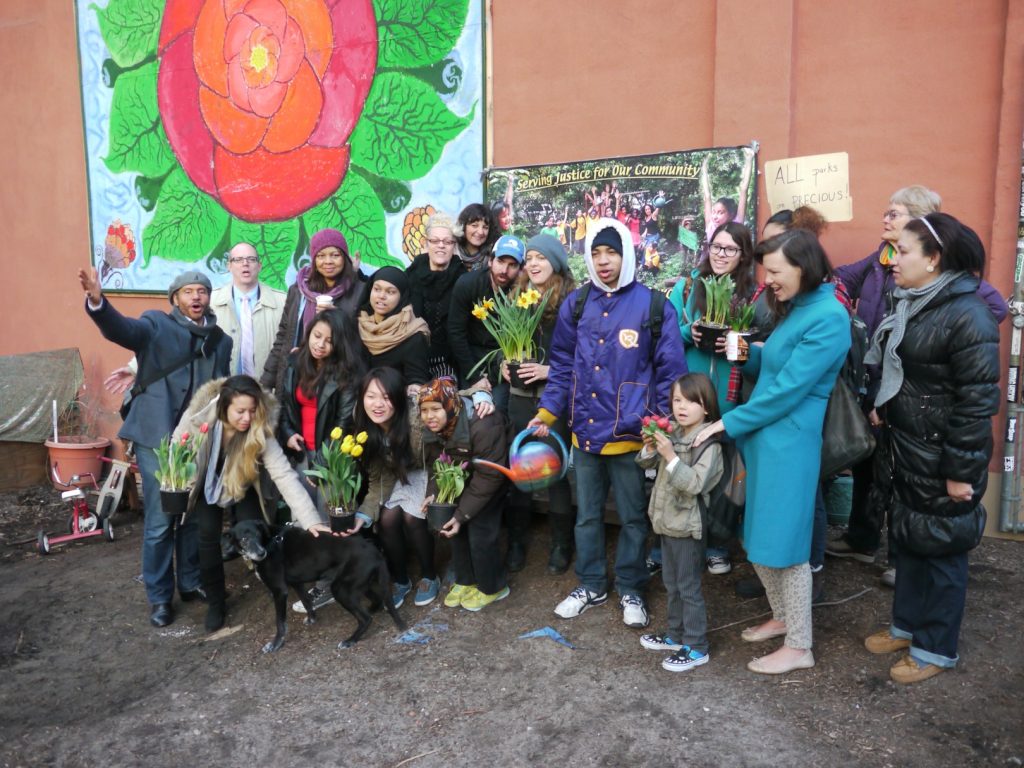 Supporters of the Children's Magical Garden came together Tuesday, resolving to reclaim a lot that is slated for a development project. 