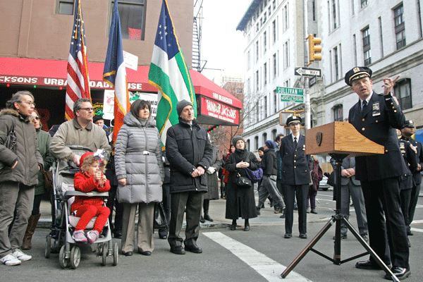 N.Y.P.D. Manhattan South Commander William Morris spoke at the March 14 memorial, honoring the families of Nicholas Pekearo and Yevgeniy Marshalik, at left.