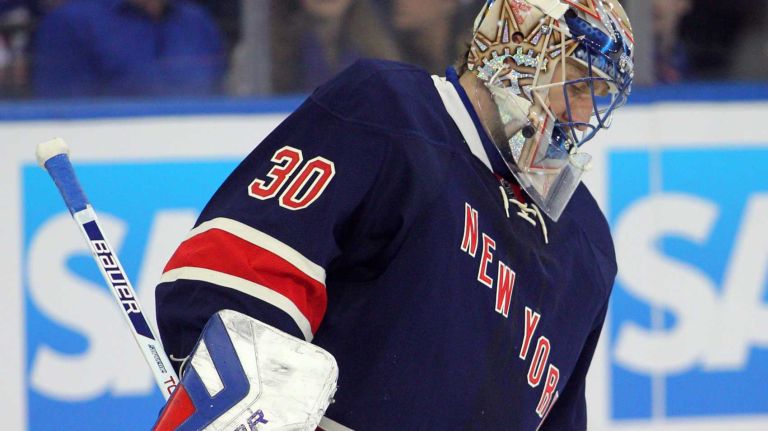Henrik Lundqvist reacts after allowing a goal to Boston Bruins defenseman Dougie Hamilton during the second period of a game at Madison Square Garden on Sunday, March 2, 2014.