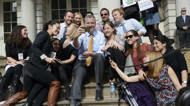 On the first 60 degree day of his mayorship mayoralty, Mayor Bill de Blasio takes a selfie with the press, including our own Emily Ngo and Matthew Chayes, on steps of City Hall March 11, 2014.