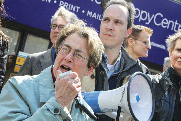 Determined: Deborah Glick spoke at Saturday’s victory rally at LaGuardia Park as attorney Jim Walden stood behind her.    Photo by Tequila Minsky