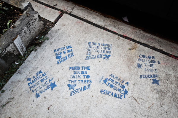Blue stencils recently appeared on the sidewalk near where Jessica Dworkin was killed by a tractor-trailer in April 2012.  Photo by Tequila Minsky
