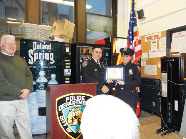 Cop of the Month's Hollywood-Style Collar 1 Photo by Scott Stiffler Cop of the Month Susan McKenna receives the honor from Captain David Miller, commander of the 10th Precinct.