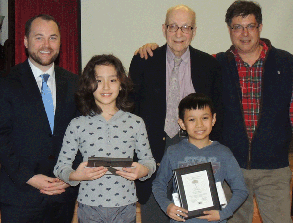 Photo by Pamela Wolff They’re all winners: At Chelsea Waterside Park Association’s annual meeting, students from PS 33 were honored for placing in the Parkside Writing Contest. From left: NY City Councilmember Corey Johnson, third place winner Josephine Kinlan, CWPA president Robert Trentlyon, first place winner Nathaniel Lok and Donathan Salkaln, CWPA Board member and contest judge Donathan Salkaln (not pictured: second place winner Catherine Chung). 