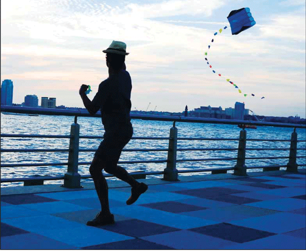 Express wins 2 awards 1 Downtown Express file photo by Milo Hess This Milo Hess photograph at Pier 25 last summer earned a feature photo award from the New York Press Association.