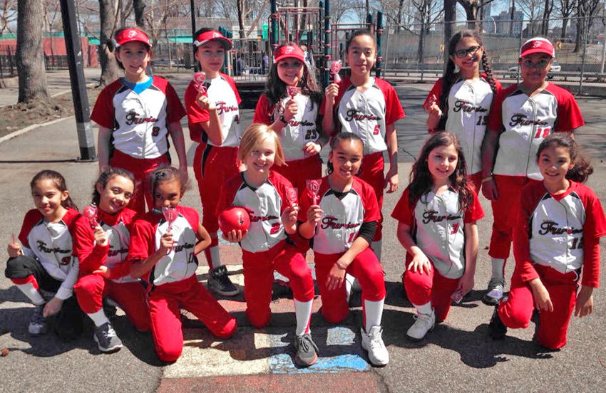 The fledgling Lady Furies softball team practices 50 weeks out of the year, and even cross-trains with mixed martial arts. Photos by Damien Acevedo