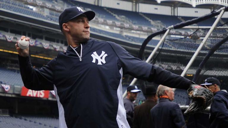 New York Yankees captain Derek Jeter warms up prior to the start of his final home opener against the Baltimore Orioles at Yankee Stadium on April 7, 2014.