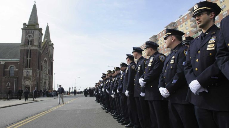 Mayor: 'Duty came first' for fallen NYPD Officer Dennis Guerra 2 Police line up at St. Rose of Lima Roman Catholic Church for the funeral Mass for fallen NYPD Officer Dennis Guerra on Monday, April 14, 2014. Guerra, 38, died early April 9, 2014 of smoke inhalation and carbon monoxide poisoning after he and fellow officer Rosa Rodriguez were overcome by dense smoke and toxic fumes in a Coney Island high-rise fire on April 6.