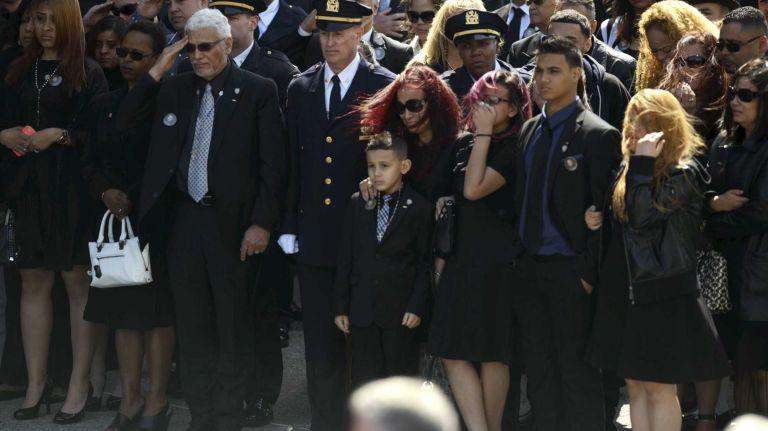 NYPD Officer Dennis Guerra remembered at memorial, funeral 25 Family members watch as the coffin of fallen NYPD Officer Dennis Guerra is carried into St. Rose of Lima Roman Catholic Church for his funeral Mass on Monday, April 14, 2014. Guerra, 38, died April 9 of smoke inhalation and carbon monoxide poisoning after he and fellow officer Rosa Rodriguez were overcome by dense smoke and toxic fumes in a Coney Island high-rise fire on April 6.