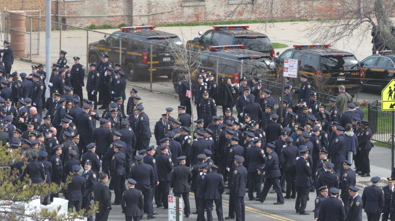 NYPD Officer Dennis Guerra remembered at memorial, funeral 40 Police arrive to pay respects before a funeral Mass at St. Rose of Lima Church in Far Rockaway April 14, 2014, for NYPD Officer Dennis Guerra who died of smoke inhalation on April 9. Guerra and his partner were injured after responding to a fire at a Coney Island high rise on April 6.