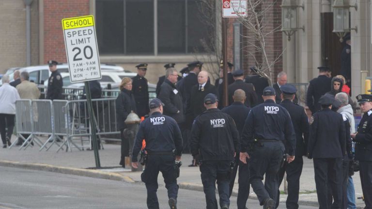 NYPD Officer Dennis Guerra remembered at memorial, funeral 41 Police arrive before a funeral Mass at St. Rose of Lima Church April 14, 2014, in Far Rockaway to pay respects to NYPD Officer Dennis Guerra who died of smoke inhalation on April 9. Guerra and his partner were injured after responding to a fire at a Coney Island high rise on April 6.
