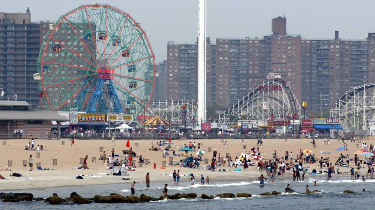 Beachgoers enjoy Coney Island on July 9, 2002. 