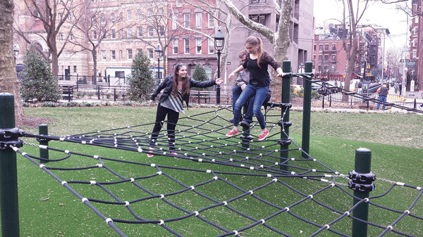 New lawn, rope-play feature open in Washington Square 1 Olivia Markel, left, gave a hand to her sister Anneke on the new cable-rope play structure as dad, Clayton, behind them, waited his turn to try his balancing skill. Photo by Lincoln Anderson