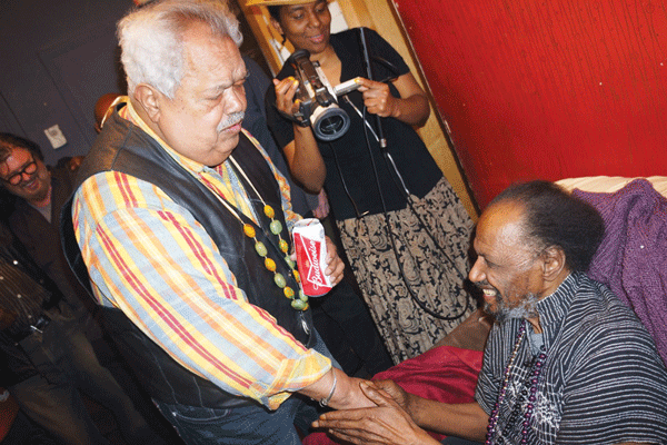 During Tribes’ second-to-last night, Miguel Algarin, founder of the Nuyorican Poets Cafe, stopped by to wish his friend and fellow bard Steve Cannon well.  Photo by Sarah Ferguson