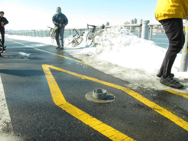 This sheathing for a bollard (which had been removed for snow plowing) caused the accident.