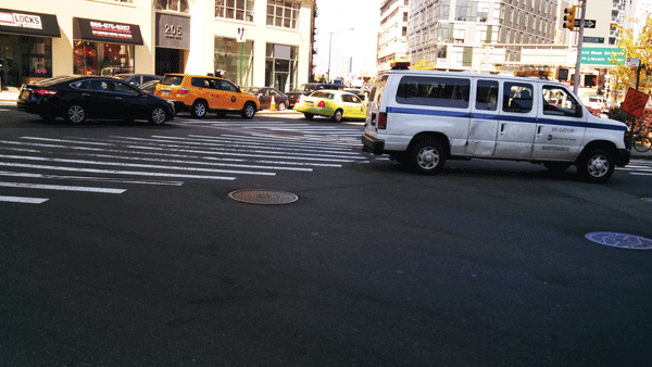 Downtown Express photo by Josh Rogers A Metropolitan Transportation Authority vehicle crosses Canal against the light when would-be pedestrians still had time to pass.