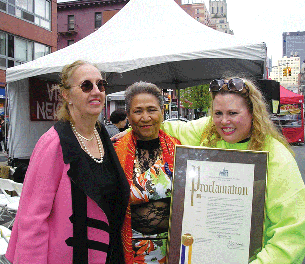 Senior Talent Show Gives Prizes, Gets Proclamation 2 Courtesy of Visiting Neighbors Manhattan Borough President Gale Brewer presents a Proclamation honoring Visiting Neighbors and the 20th anniversary of the Senior Talent Show to Dr. Cynthia Maurer, Visiting Neighbors’ Executive Director. Performer Julia Piters (middle) looks on.