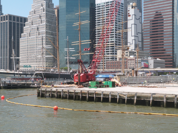 Downtown Express photo by Josh Rogers Construction work on the approved plan for Pier 17, with the South Street Seaport Museum’s tall ships in the background. 