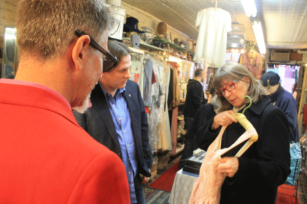 Store manager Michael Duggan, left, helped costumer designer Molly Maginnis, right, and her first assistant costume designer, Michael Sharpe, as they selected a garment for “Smash,” a TV program.  Photo by Zach Williams