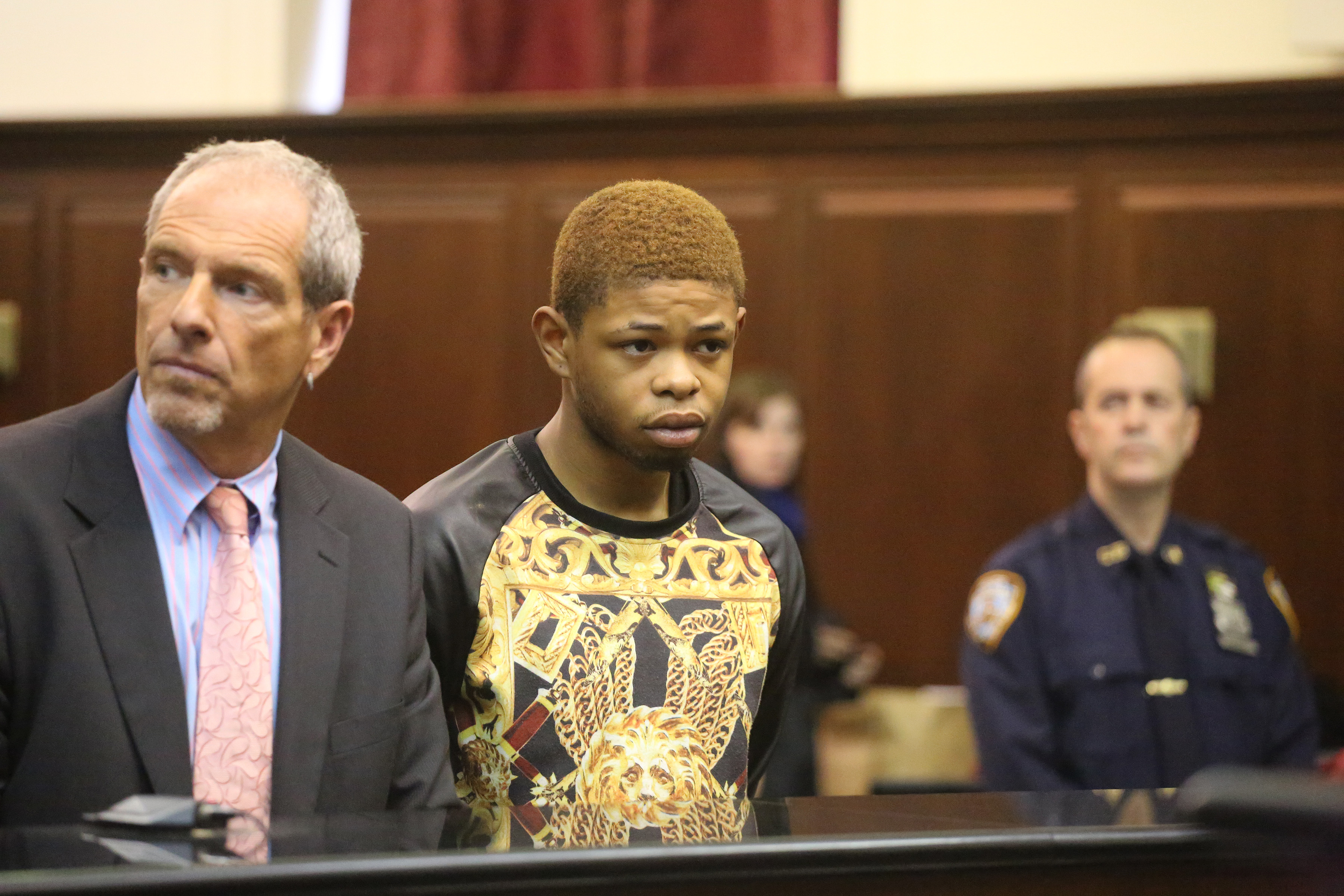 Jamie Pugh, 20, appears at his arraignment in Manhattan Criminal Court on Wed., May 14. Pugh is charged with the brutal murder of Wen Hui Ruan, 68, on E. Sixth St. near Avenue D. At left is his defense attorney, East Villager Frank Rothman.  Photo by Jefferson Siegel